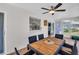 Enclosed patio features tile floors, a ceiling fan, and outdoor dining table with seating for six at 1657 Glengarry Dr, Palm Harbor, FL 34684