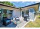 Paver patio with outdoor seating and a BBQ grill, perfect for entertaining or relaxing at 1657 Glengarry Dr, Palm Harbor, FL 34684