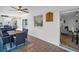 Enclosed patio with ceiling fan, table and chairs, and tiled floors for relaxing or entertaining at 1657 Glengarry Dr, Palm Harbor, FL 34684