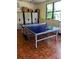 Recreation room with ping pong table, storage lockers, and tile flooring at 1657 Glengarry Dr, Palm Harbor, FL 34684