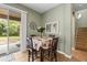 Cozy dining nook with table, chairs, and sliding glass door to the patio, blending indoor and outdoor living at 18243 Cypress Bay Pkwy, Land O Lakes, FL 34638