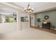 Open dining area with neutral carpet, chandelier, and views of the kitchen and living spaces at 18243 Cypress Bay Pkwy, Land O Lakes, FL 34638