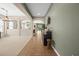 Inviting foyer with open floor plan, tile entry, transitioning to carpet, adjacent to a neutral-toned room at 18243 Cypress Bay Pkwy, Land O Lakes, FL 34638