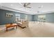 Spacious game room with comfortable seating, ping pong table, and recessed lighting at 18243 Cypress Bay Pkwy, Land O Lakes, FL 34638