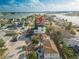Aerial view of a modern condo building in a waterfront neighborhood with ample parking and convenient street access at 187 145Th E Ave # 3, Madeira Beach, FL 33708