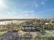 Wide aerial perspective of the multi-unit property situated near a body of water, offering panoramic views of the surrounding landscape at 187 145Th E Ave # 3, Madeira Beach, FL 33708