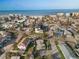 Aerial view of the property's location near the beach with surrounding homes, palm trees, and clear blue ocean waters at 187 145Th E Ave # 3, Madeira Beach, FL 33708