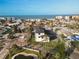 Panoramic aerial view of the property near the ocean, highlighting its coastal neighborhood and surrounding area at 187 145Th E Ave # 3, Madeira Beach, FL 33708