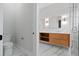 Bathroom with toilet and vanity, featuring marble floors and modern fixtures at 187 145Th E Ave # 3, Madeira Beach, FL 33708