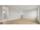 Spacious bedroom boasts hardwood floors and access to a stylish bathroom with a glass shower at 187 145Th E Ave # 3, Madeira Beach, FL 33708
