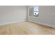 The large bright bedroom has hardwood floors at 187 145Th E Ave # 3, Madeira Beach, FL 33708