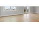 Sunlit bedroom featuring wood floors, neutral walls and a great view from the window and balcony at 187 145Th E Ave # 3, Madeira Beach, FL 33708