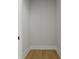 Interior of an empty closet with hardwood floors is ready for customization and storage at 187 145Th E Ave # 3, Madeira Beach, FL 33708