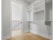 Walk-in closet with open shelving and hanging rods provides ample storage space at 187 145Th E Ave # 3, Madeira Beach, FL 33708