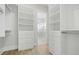 Spacious closet features custom built-ins with shelves and drawers for organized storage at 187 145Th E Ave # 3, Madeira Beach, FL 33708