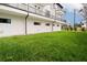 Back of building showing grassy yard and patio space at 187 145Th E Ave # 3, Madeira Beach, FL 33708