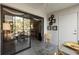 Relaxing enclosed balcony with a dining area and sliding glass doors to the living space at 19029 Us Highway 19 N # 26-204, Clearwater, FL 33764