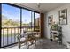 Cozy balcony overlooking the parking lot features a bistro set and decorative accents at 19029 Us Highway 19 N # 26-204, Clearwater, FL 33764