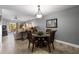 Open-concept dining area with tiled floor and natural light complements the living area at 19029 Us Highway 19 N # 26-204, Clearwater, FL 33764