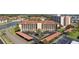 Stunning aerial view of the condo building featuring covered parking and lovely landscaping near the water at 19029 Us Highway 19 N # 26-204, Clearwater, FL 33764