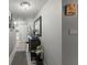 Hallway features decorative accents and storage, creating a stylish and functional transition space within the condo at 19029 Us Highway 19 N # 26-204, Clearwater, FL 33764