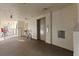 Well-lit hallway featuring an elevator and a bicycle, providing easy access and convenience for residents at 19029 Us Highway 19 N # 26-204, Clearwater, FL 33764
