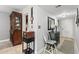 Hallway with elegant decor, a mirror, and storage cabinet creates a refined and functional entryway into the home at 19029 Us Highway 19 N # 26-204, Clearwater, FL 33764