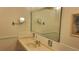 Bathroom with an extended vanity, unique faucet and framed mirror with wall mounted magnifying mirror at 19029 Us Highway 19 N # 8-13, Clearwater, FL 33764