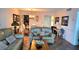 Cozy living room with comfortable seating, decorative accents, and tile flooring at 19029 Us Highway 19 N # 8-13, Clearwater, FL 33764