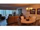 Open-concept living and dining area with stylish decor and lots of natural light at 19029 Us Highway 19 N # 8-13, Clearwater, FL 33764
