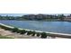 Beautiful water view of the canal with manicured bushes and a large building in the background at 19029 Us Highway 19 N # 8-13, Clearwater, FL 33764