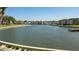 Scenic water view overlooking a canal with lush landscaping and buildings on both sides under a clear blue sky at 19029 Us Highway 19 N # 8-13, Clearwater, FL 33764
