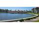 Wide canal view with resort and condominium buildings in the background on a beautiful sunny day at 19029 Us Highway 19 N # 8-13, Clearwater, FL 33764