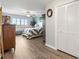 Spacious bedroom featuring wood floors, a ceiling fan, a view, and a closet at 19029 Us Highway 19 N # 9-407, Clearwater, FL 33764