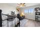 Cozy bedroom with a ceiling fan, an accent chair, a large window with a view at 19029 Us Highway 19 N # 9-407, Clearwater, FL 33764