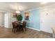 Cozy dining area featuring a modern chandelier and a round table for four at 19029 Us Highway 19 N # 9-407, Clearwater, FL 33764