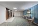 Hallway offers elevator access and comfortable seating with tasteful décor and vibrant lighting at 19029 Us Highway 19 N # 9-407, Clearwater, FL 33764