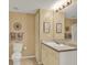 Functional bathroom with coordinated accessories and a neutral color scheme at 1910 E Palm Ave # 11216, Tampa, FL 33605