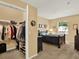 Well-organized closet complements a bright bedroom with a dark wood bed at 1910 E Palm Ave # 11216, Tampa, FL 33605