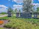 KBar Ranch community entrance sign set against a backdrop of landscaping and a serene sky at 19325 Hawk Valley Dr, Tampa, FL 33647