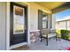 Inviting front porch features decorative brickwork and a cozy bench at 19325 Hawk Valley Dr, Tampa, FL 33647