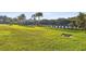 Expansive grassy grounds featuring a community tennis court and clubhouse at 19325 Hawk Valley Dr, Tampa, FL 33647