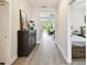 Hallway with wood-look tile flooring leads to the main living areas and bedrooms at 19325 Hawk Valley Dr, Tampa, FL 33647