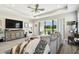 Relaxing living room features a large window, tray ceiling, and comfortable seating at 19325 Hawk Valley Dr, Tampa, FL 33647