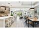 Open concept living space with kitchen, dining, and living room flowing together seamlessly at 19325 Hawk Valley Dr, Tampa, FL 33647