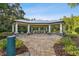 A community outdoor pavilion featuring an elegant design, a grilling area, and seating at 19325 Hawk Valley Dr, Tampa, FL 33647