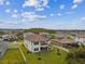Aerial view of a spacious home with a large backyard, covered patio, and scenic surroundings at 19719 Cypress Bridge Dr, Odessa, FL 33556