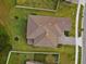 Birds eye view of the property highlighting the roof, lawn, landscaping, and proximity to the street at 19719 Cypress Bridge Dr, Odessa, FL 33556