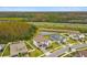 New construction homes backing up to a pond and highway in a community with mature trees at 19719 Cypress Bridge Dr, Odessa, FL 33556