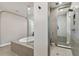 Bathroom featuring a glass enclosed shower, tiled floor, and large soaking tub at 19719 Cypress Bridge Dr, Odessa, FL 33556